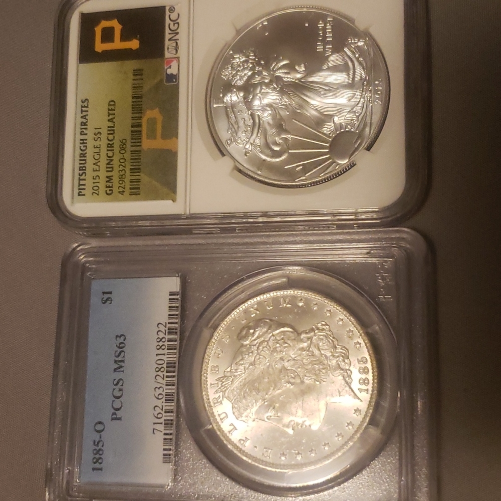 Here's what you're getting. 1885-0 pcgs ms63 Morgan. And a 2015 Gem Uncirculated